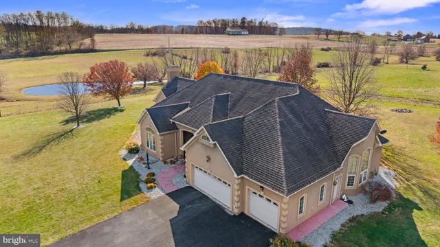 a view of a swimming pool with a yard