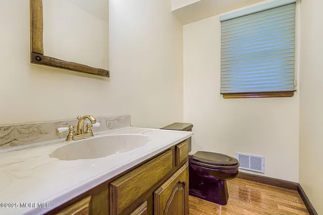a view of a hallway with windows and stairs