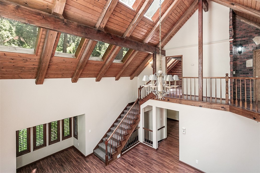 760 Kuffel Canyon Road Lake Arrowhead, CA 92385 - Photo 14 of 24 a view of a balcony with wooden floor