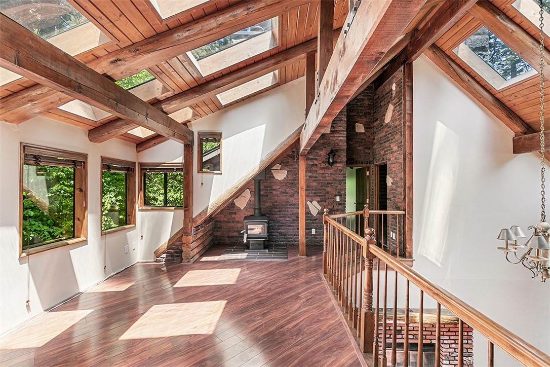760 Kuffel Canyon Road Lake Arrowhead, CA 92385 - Photo 15 of 24 a view of balcony with wooden floor and stairs