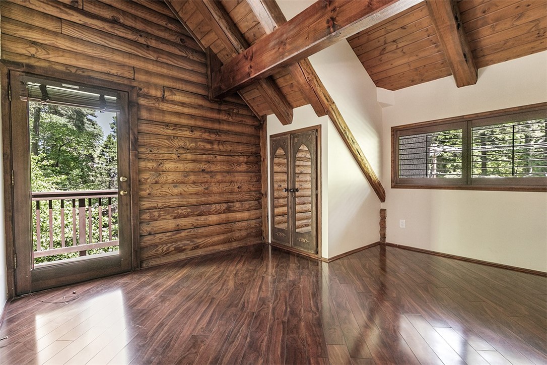760 Kuffel Canyon Road Lake Arrowhead, CA 92385 - Photo 17 of 24 wooden floor in an empty room with a window