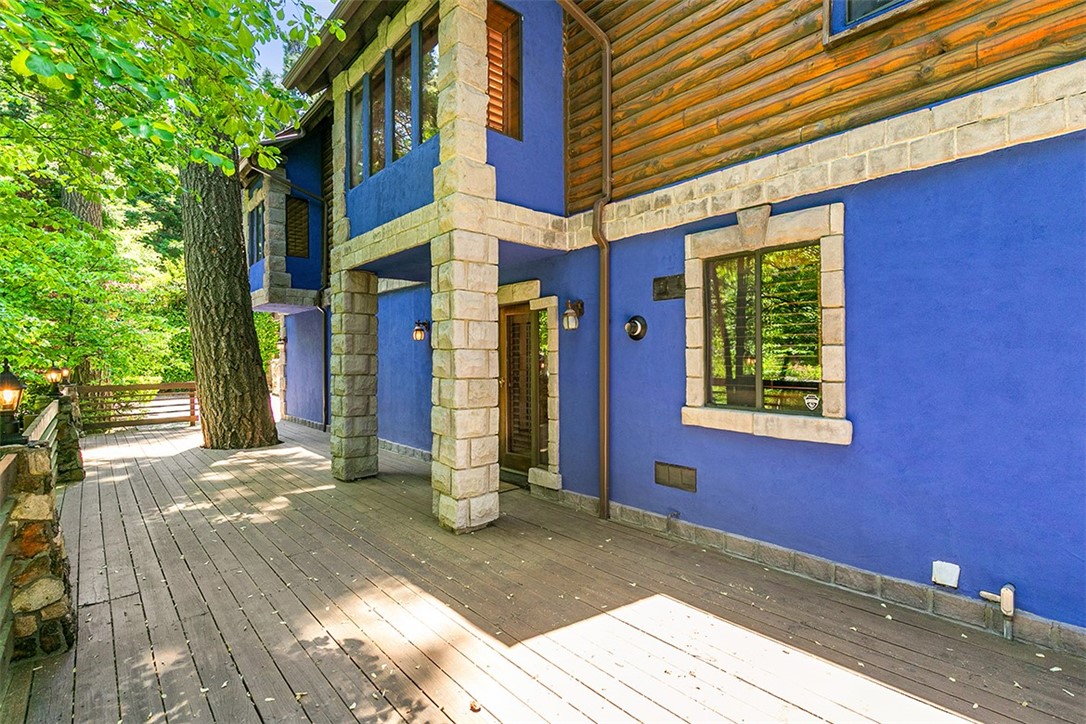 760 Kuffel Canyon Road Lake Arrowhead, CA 92385 - Photo 4 of 24 a view of a building with brick walls