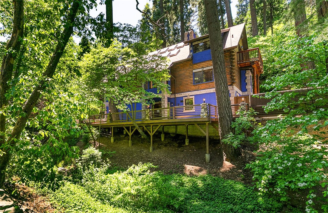 760 Kuffel Canyon Road Lake Arrowhead, CA 92385 - Photo 10 of 24 a view of swimming pool with a bench and trees
