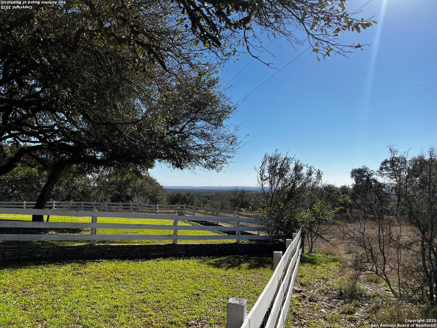 205 Crabapple Road Kendalia, TX 78027 - Photo 2 of 9 a view of a yard with swimming pool