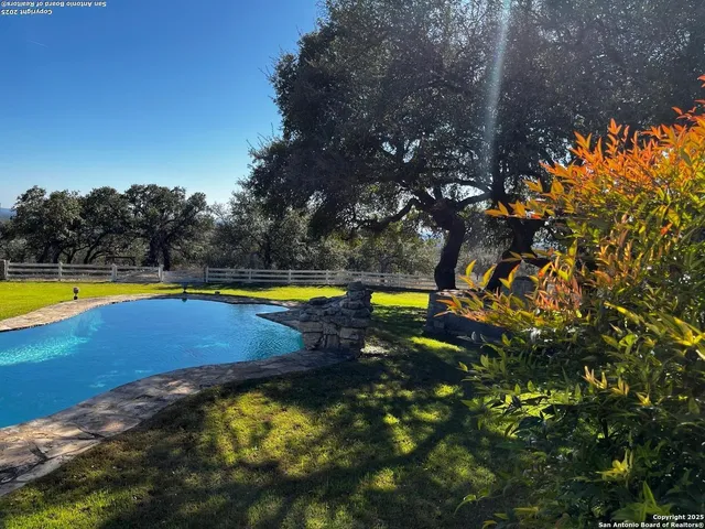 a view of swimming pool with an outdoor space and sitting area