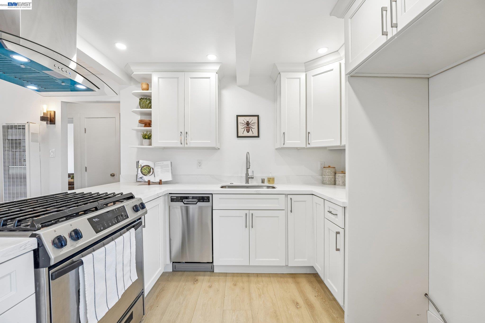 606 West 9th Street Santa Rosa, CA 95401 - Photo 28 of 52 a kitchen with stainless steel appliances granite countertop a stove and a sink
