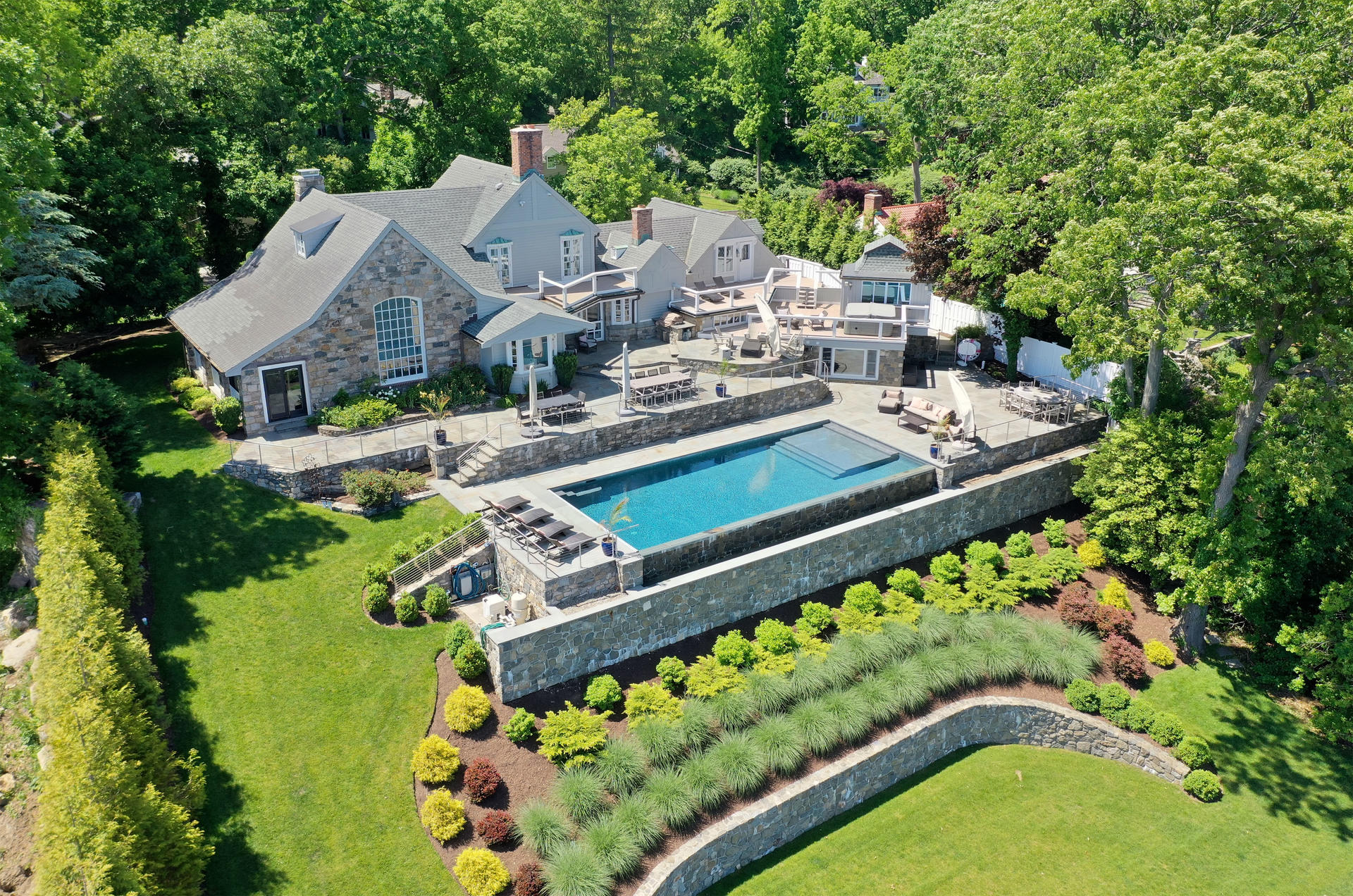 6 Woodland Road Norwalk, CT 06854 - Photo 1 of 47 a view of house with swimming pool lawn chairs and large trees
