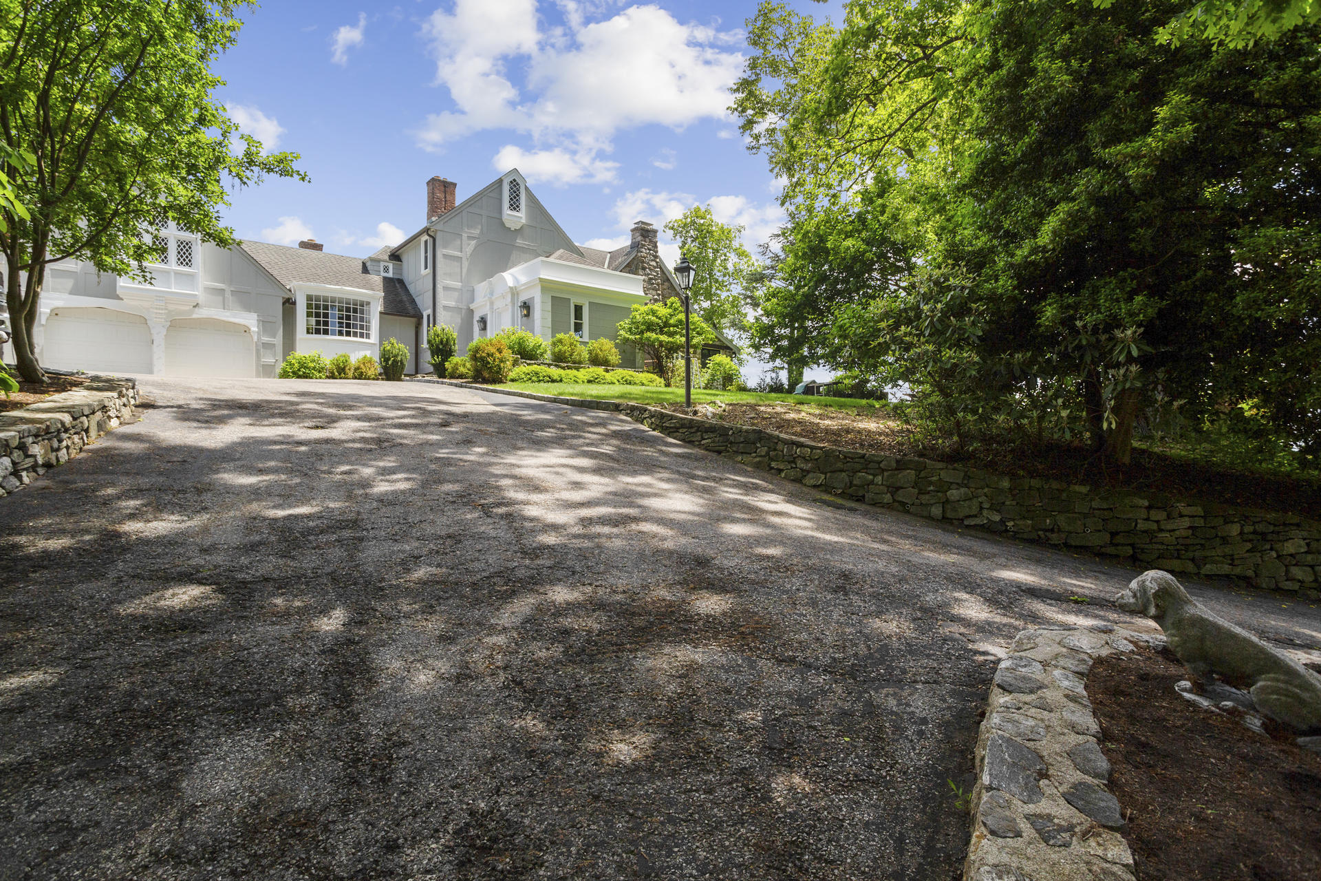 6 Woodland Road Norwalk, CT 06854 - Photo 15 of 47 a front view of a house with garden