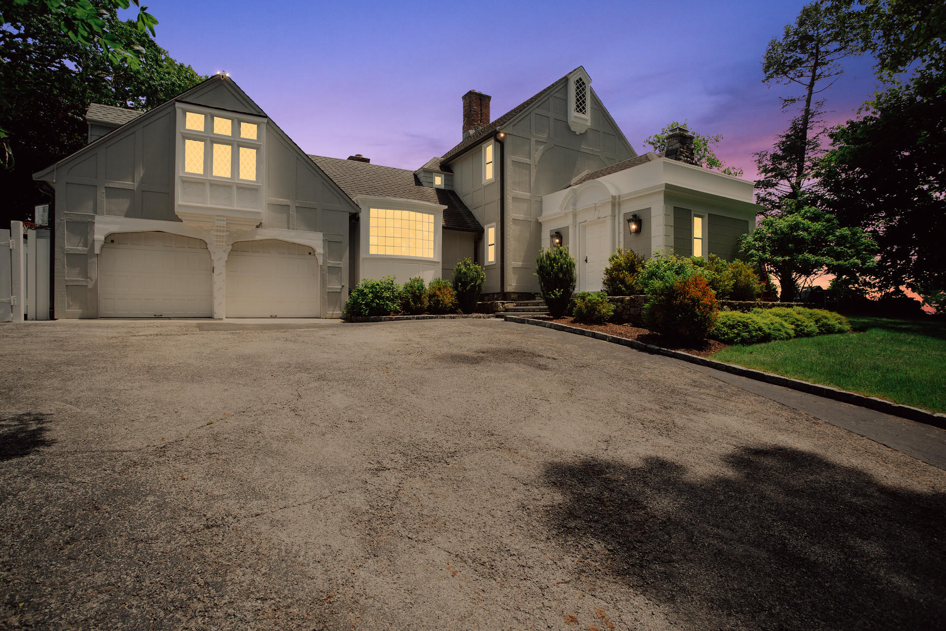 6 Woodland Road Norwalk, CT 06854 - Photo 16 of 47 a front view of a house with a garden