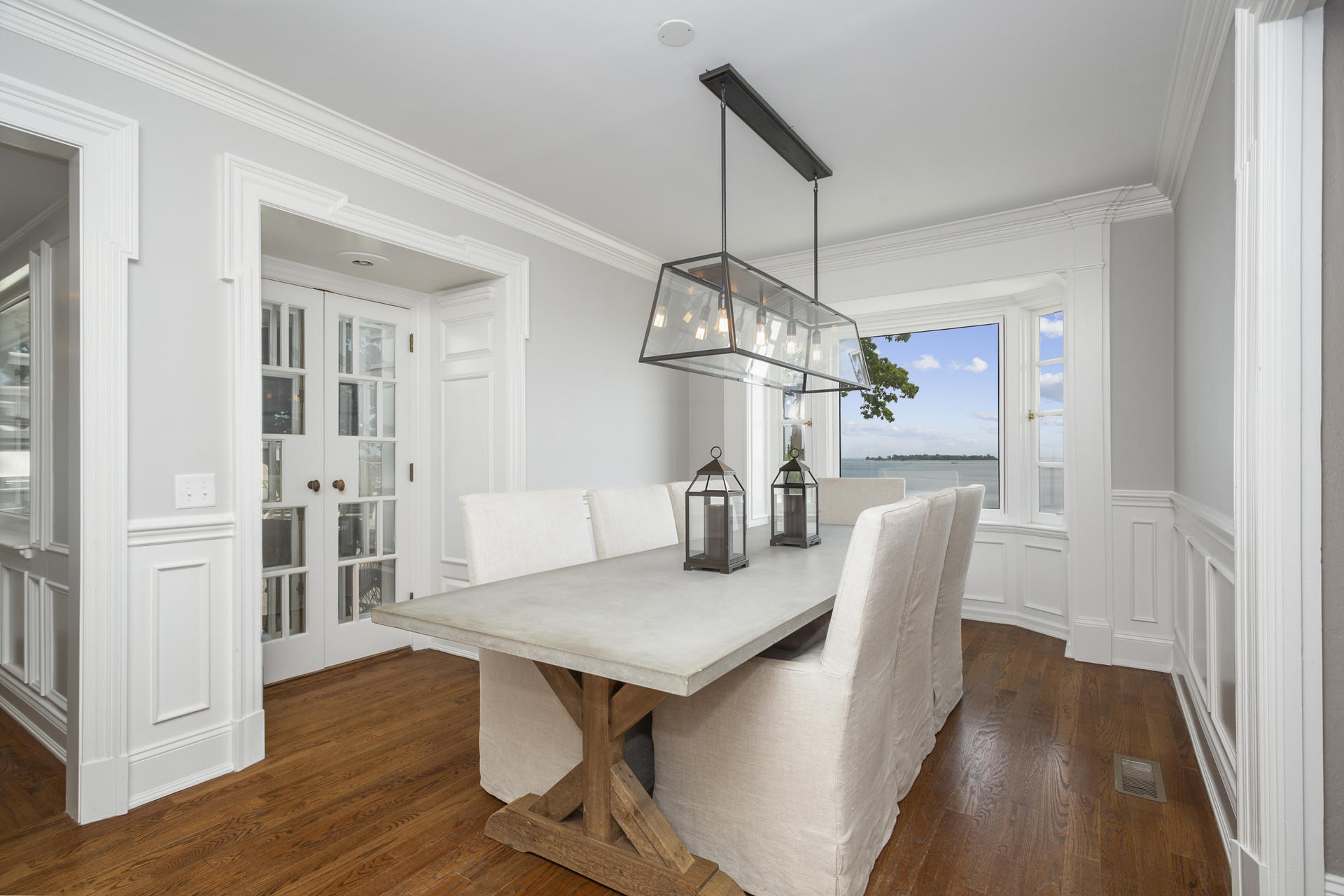 6 Woodland Road Norwalk, CT 06854 - Photo 18 of 47 a view of a dining room with furniture wooden floor and chandelier