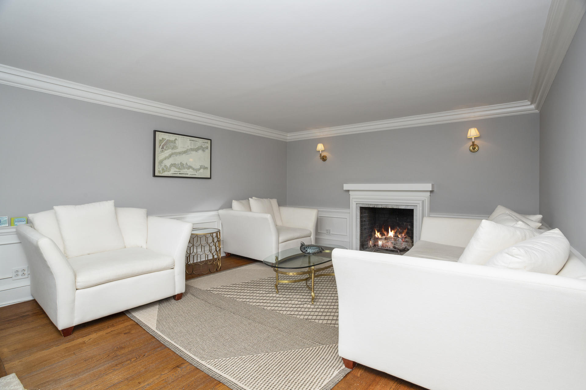 6 Woodland Road Norwalk, CT 06854 - Photo 21 of 47 a living room with furniture and a fireplace