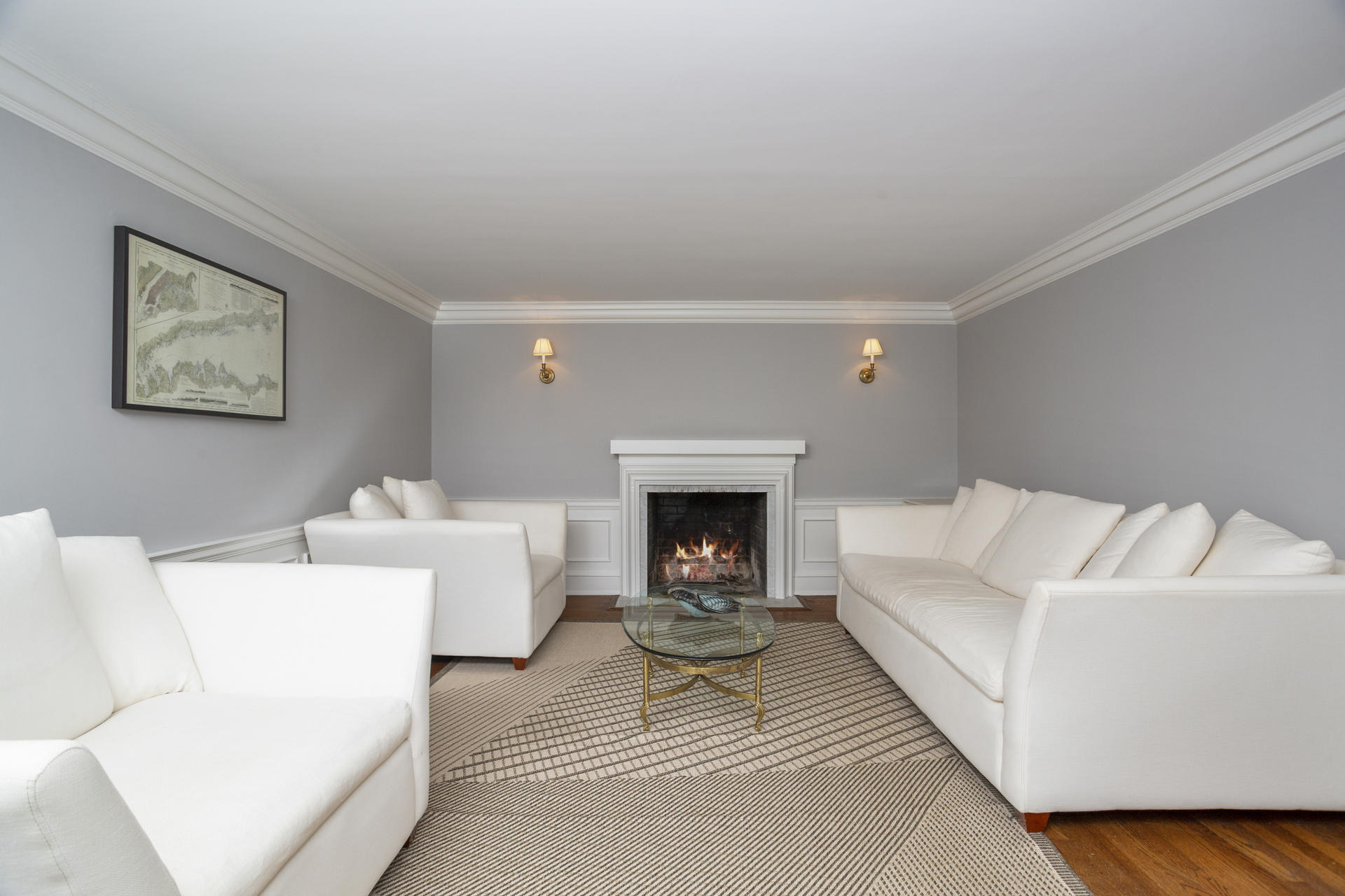 6 Woodland Road Norwalk, CT 06854 - Photo 22 of 47 a living room with furniture a fireplace and a table