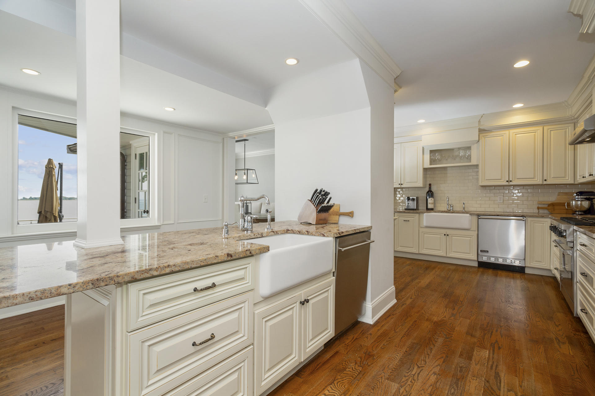6 Woodland Road Norwalk, CT 06854 - Photo 25 of 47 a kitchen with granite countertop white cabinets and white appliances