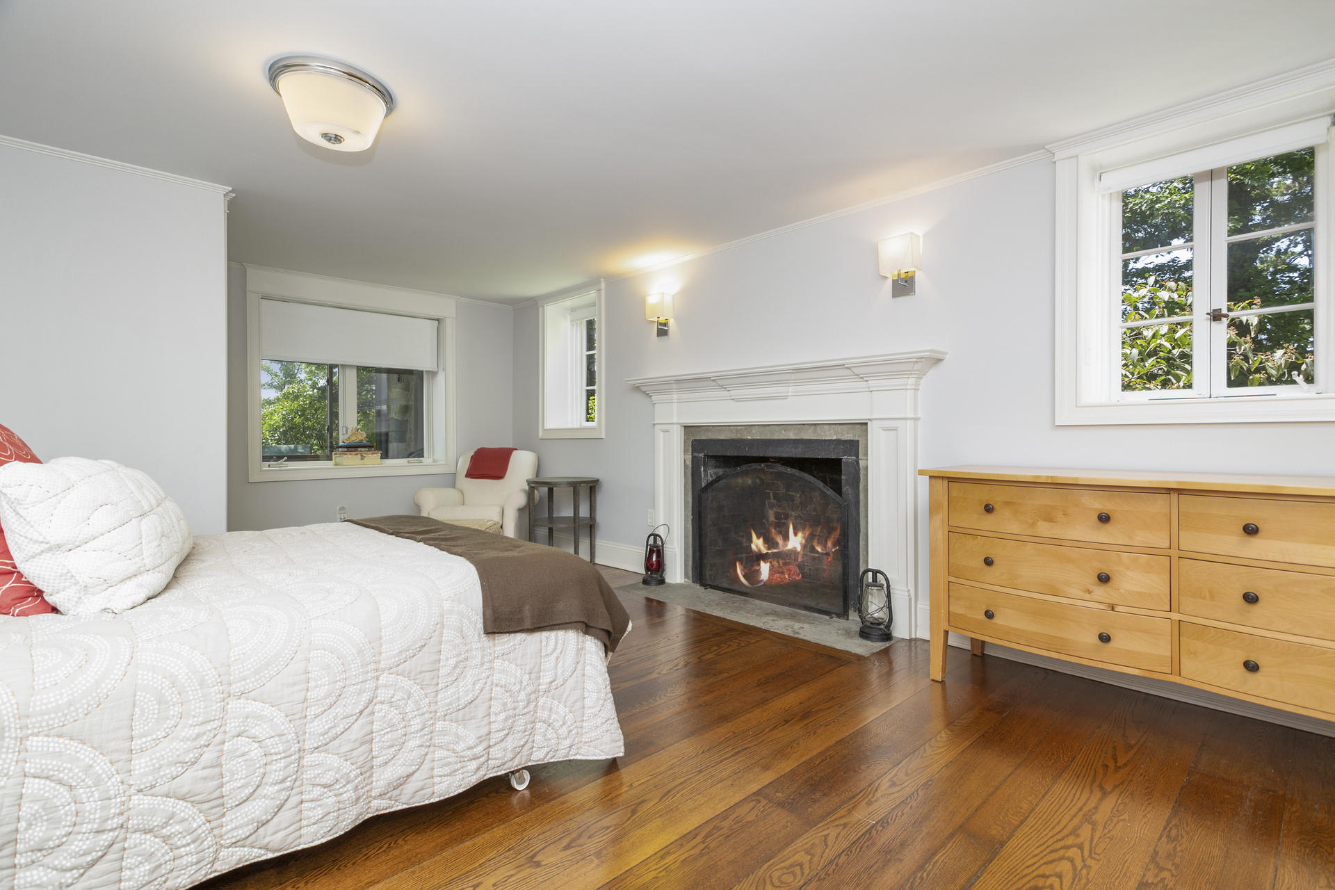 6 Woodland Road Norwalk, CT 06854 - Photo 34 of 47 a bedroom with a bed and a fireplace