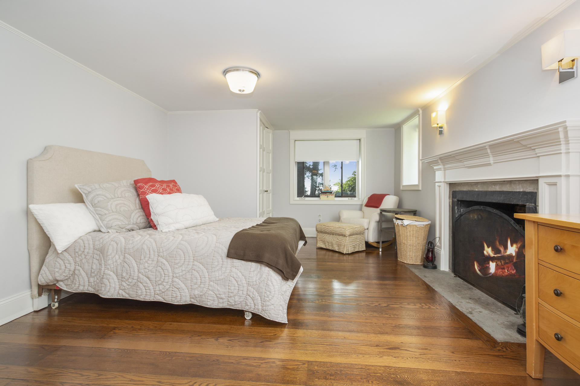 6 Woodland Road Norwalk, CT 06854 - Photo 35 of 47 a bedroom with a bed and a fireplace