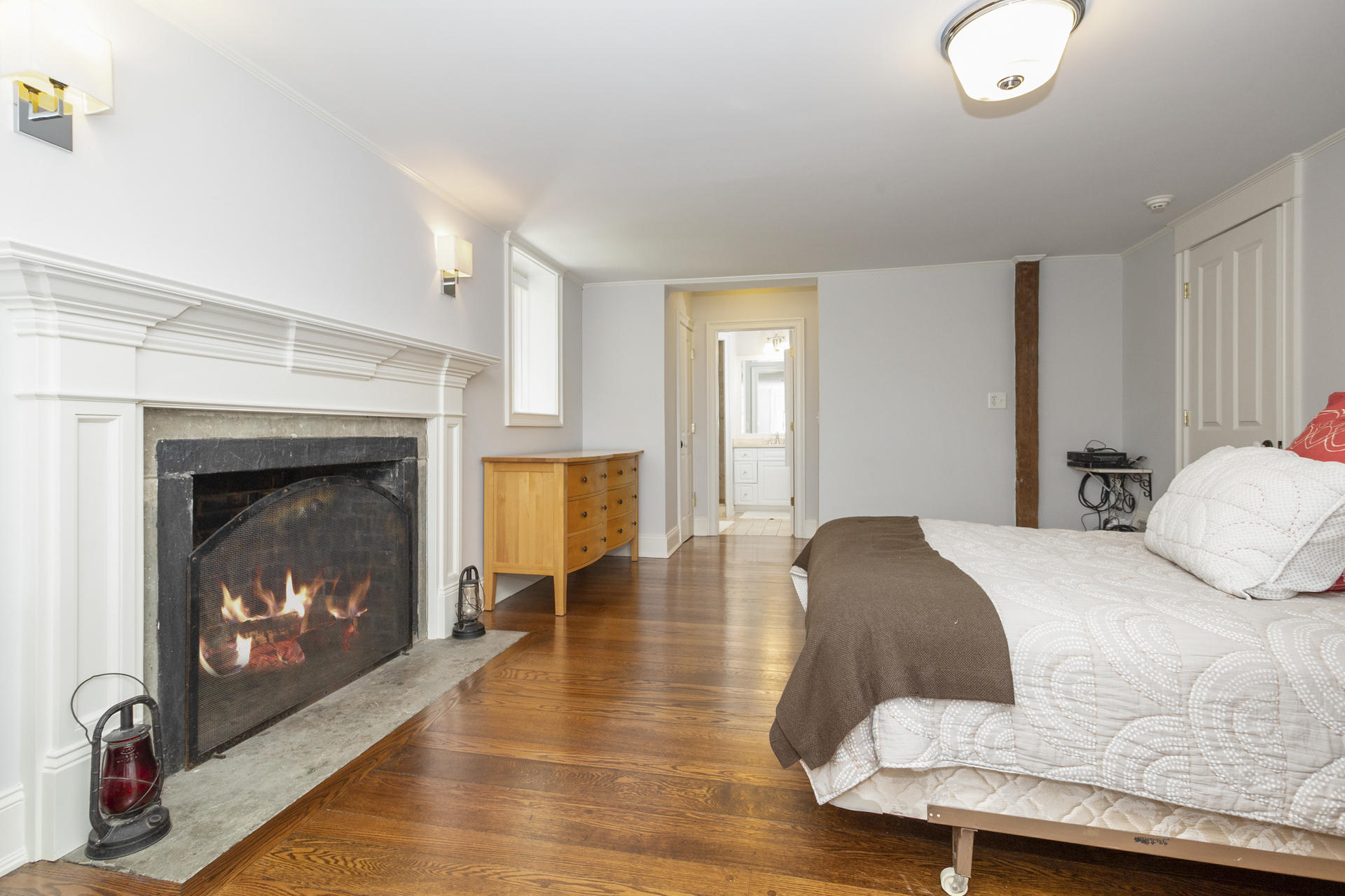 6 Woodland Road Norwalk, CT 06854 - Photo 36 of 47 a bedroom with a bed and a fireplace
