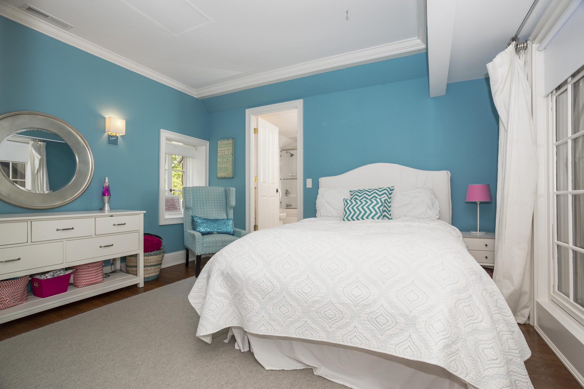 6 Woodland Road Norwalk, CT 06854 - Photo 39 of 47 a bedroom with a bed a closet and a mirror