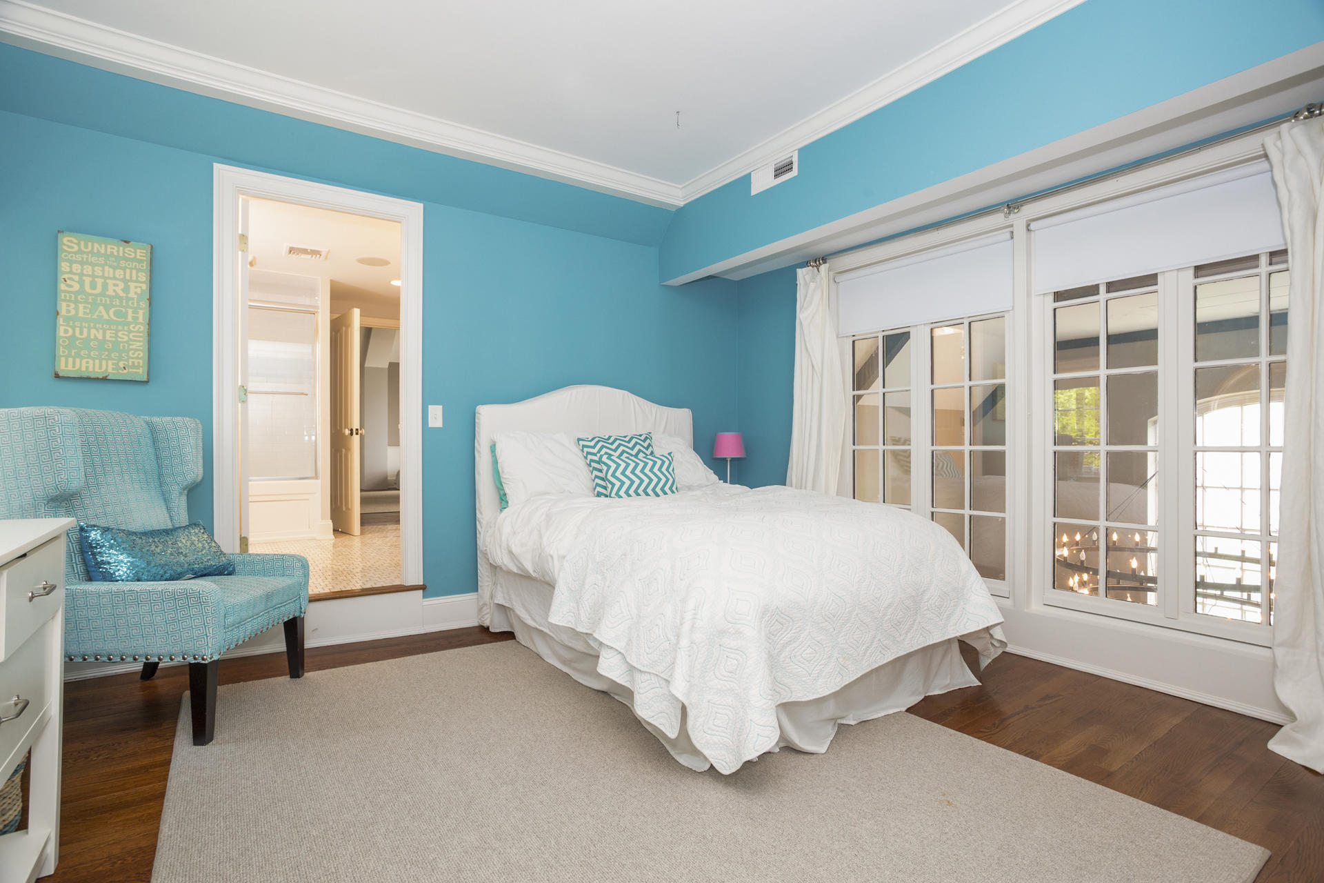 6 Woodland Road Norwalk, CT 06854 - Photo 40 of 47 a spacious bedroom with a bed and a couch next to a window