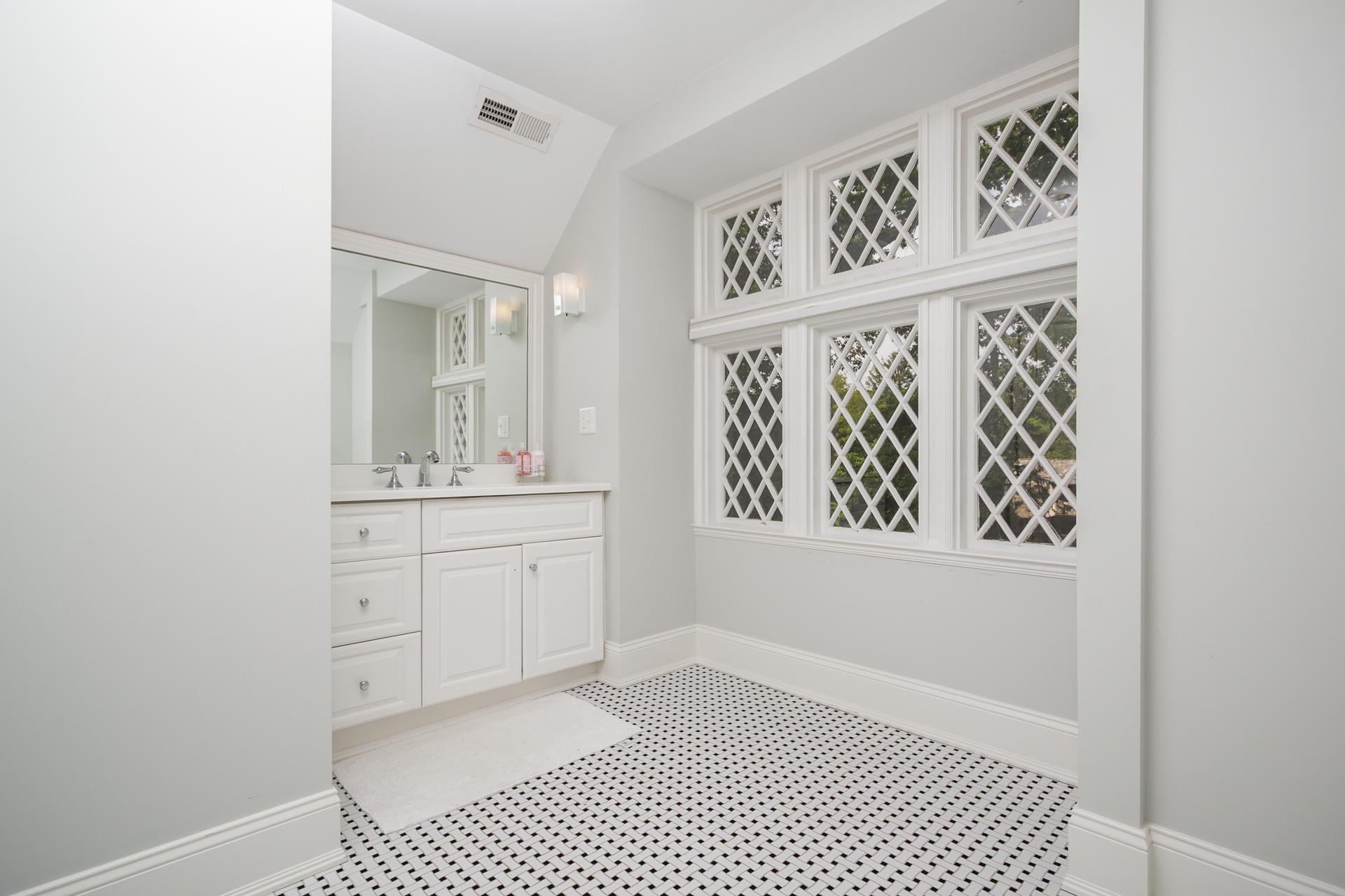 6 Woodland Road Norwalk, CT 06854 - Photo 41 of 47 a bathroom with a sink a vanity and a mirror