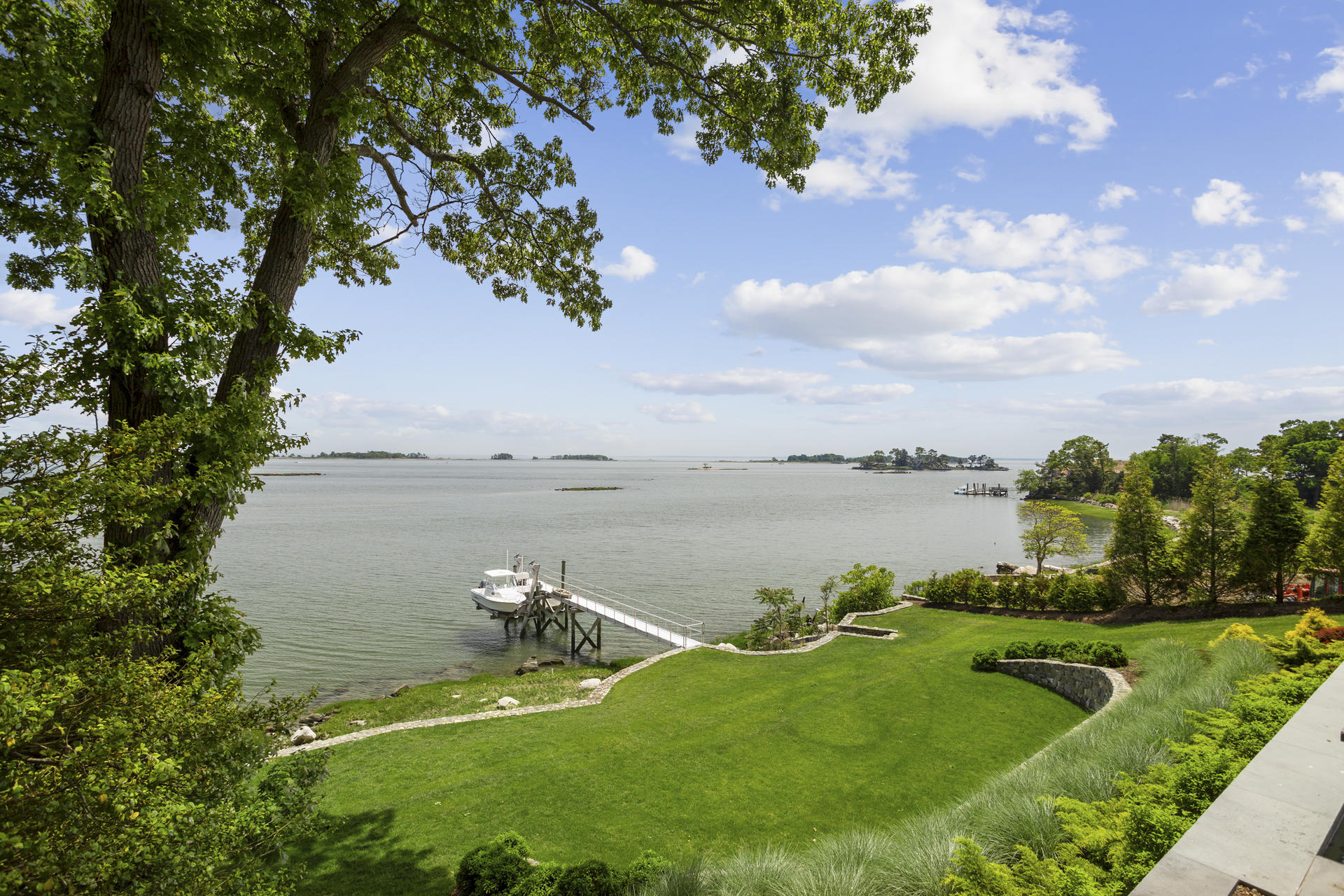 6 Woodland Road Norwalk, CT 06854 - Photo 8 of 47 a view of a lake with a big yard