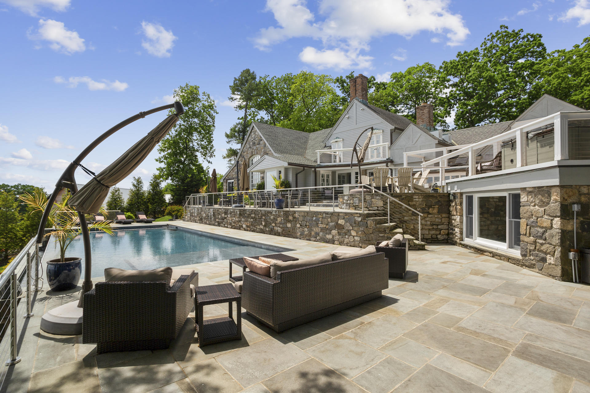 6 Woodland Road Norwalk, CT 06854 - Photo 10 of 47 a view of a terrace with couches and table