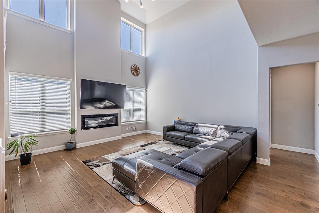 13237 Jonata Street Frisco, TX 75035 - Photo 17 of 39 a living room with furniture and a flat screen tv