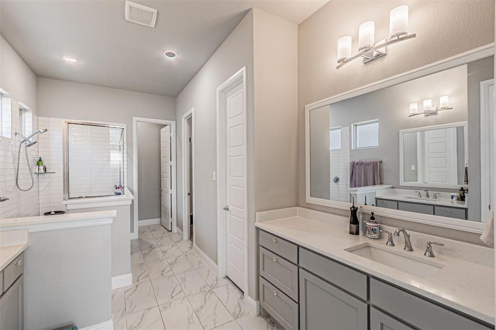 13237 Jonata Street Frisco, TX 75035 - Photo 21 of 39 a spacious bathroom with a double vanity sink mirror and double