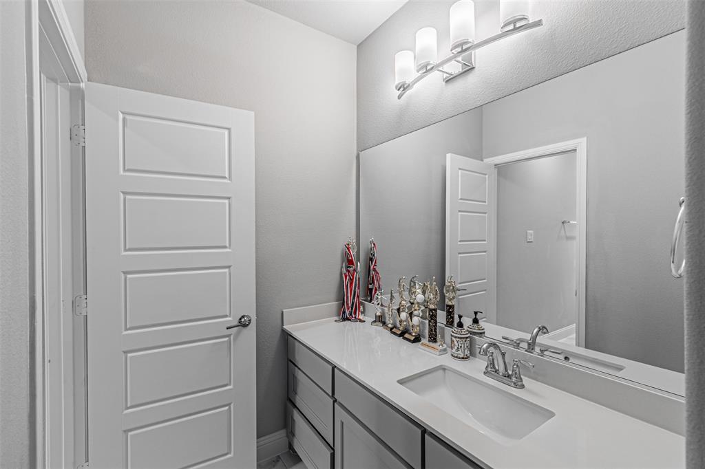 13237 Jonata Street Frisco, TX 75035 - Photo 29 of 39 a bathroom with a sink vanity and a mirror