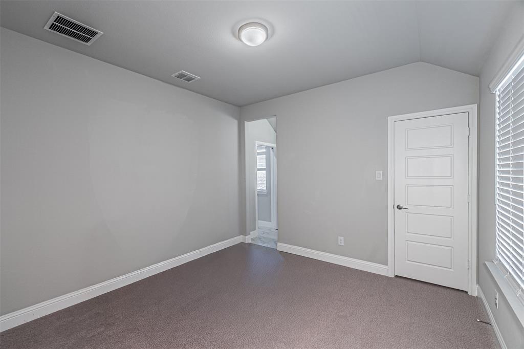 13237 Jonata Street Frisco, TX 75035 - Photo 30 of 39 an empty room with closet and windows