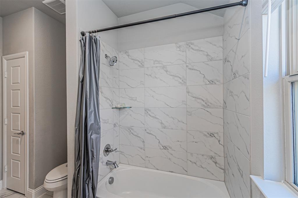 13237 Jonata Street Frisco, TX 75035 - Photo 31 of 39 a bathroom with a shower and a toilet