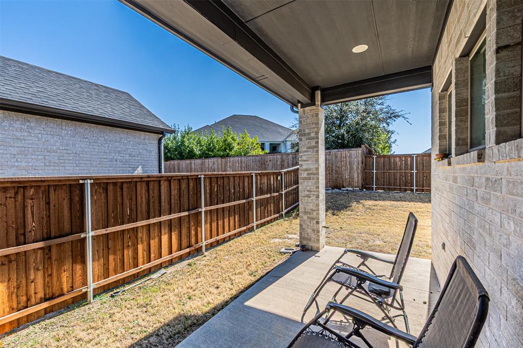 13237 Jonata Street Frisco, TX 75035 - Photo 34 of 39 a view of balcony with wooden floor and outdoor seating