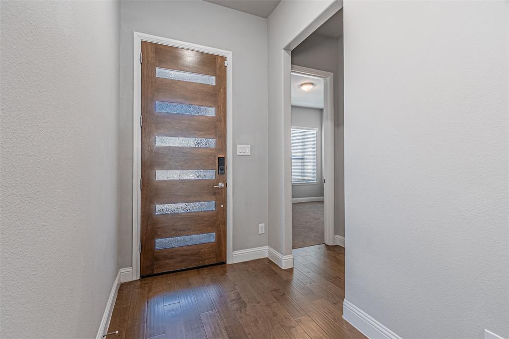 13237 Jonata Street Frisco, TX 75035 - Photo 5 of 39 a view of an empty room with wooden floor
