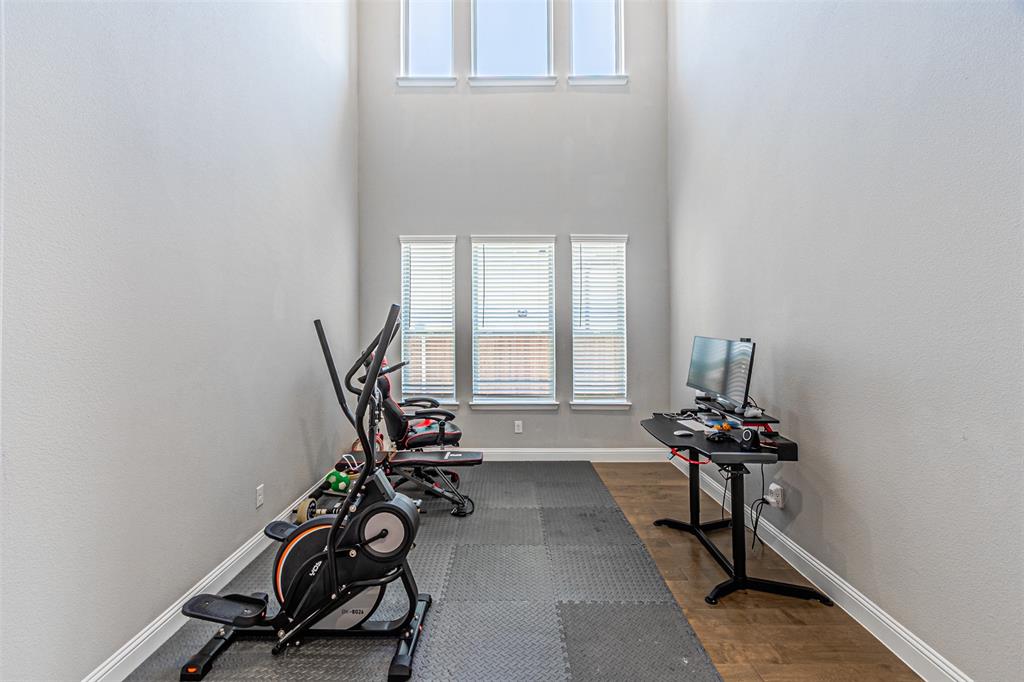 13237 Jonata Street Frisco, TX 75035 - Photo 10 of 39 a view of a room with gym equipment