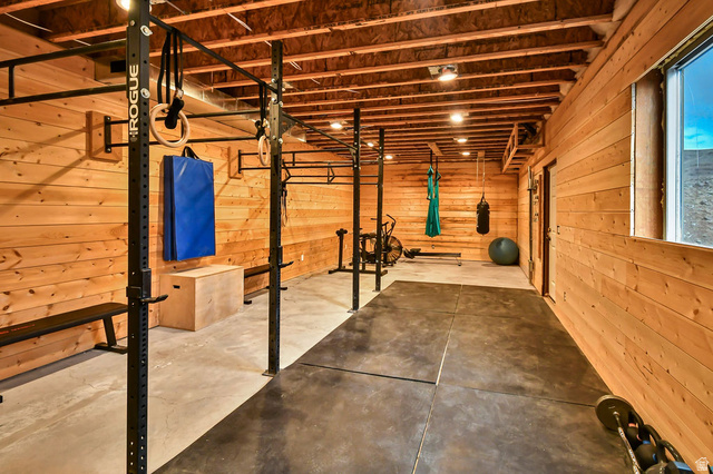 544 East 600 North, Unit 1 Joseph, UT 84739 - Photo 48 of 65 Lower-level recreation space featuring wood-paneled walls and exposed ceiling beams