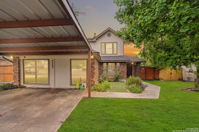 a front view of a house with a yard and porch
