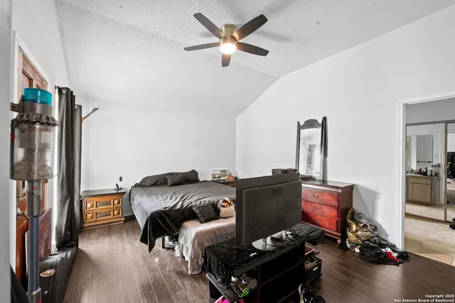 a bedroom with furniture and a window