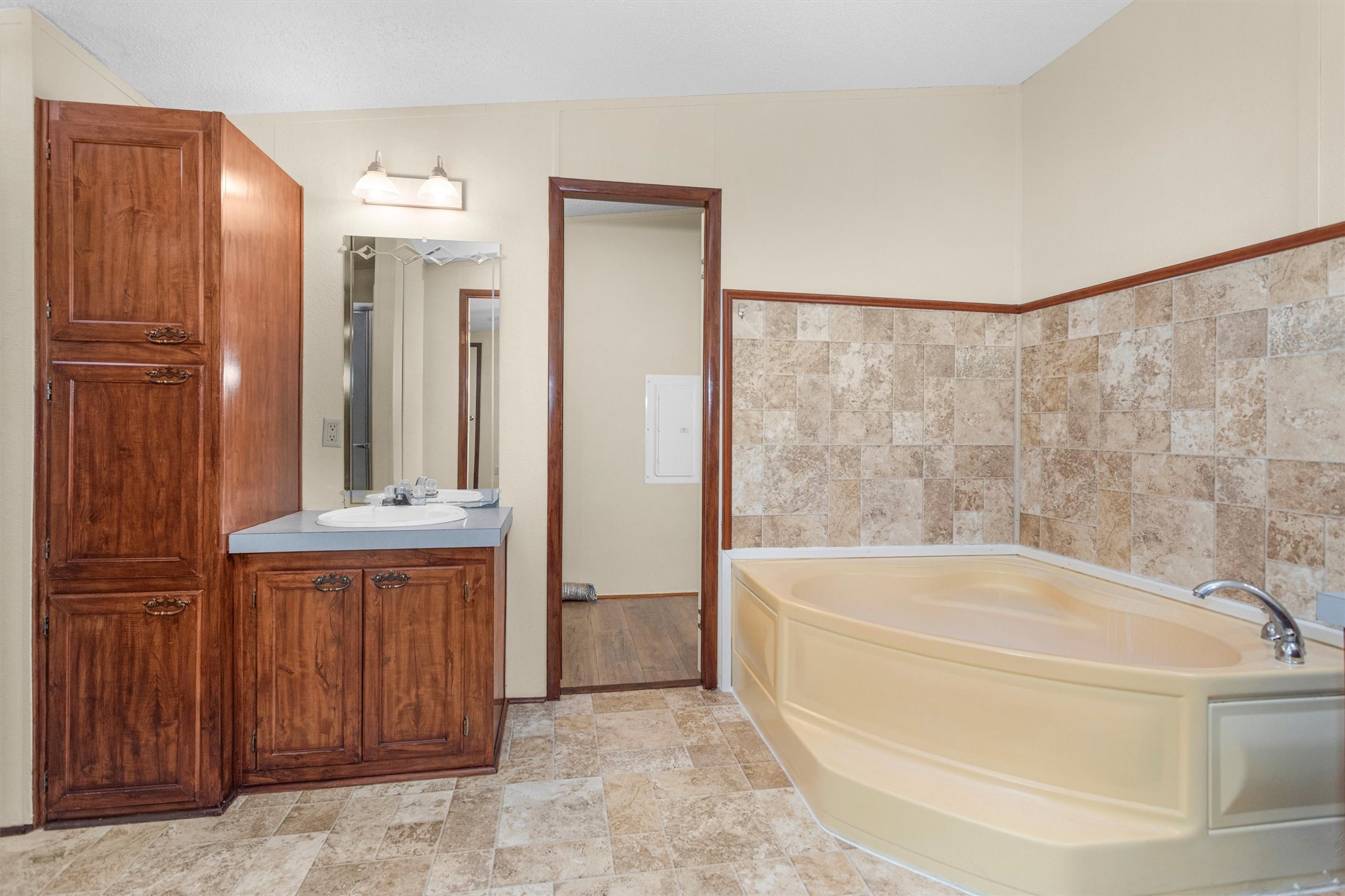 11261 Rose Road Conroe, TX 77303 - Photo 19 of 30 a bathroom with a bathtub and shower