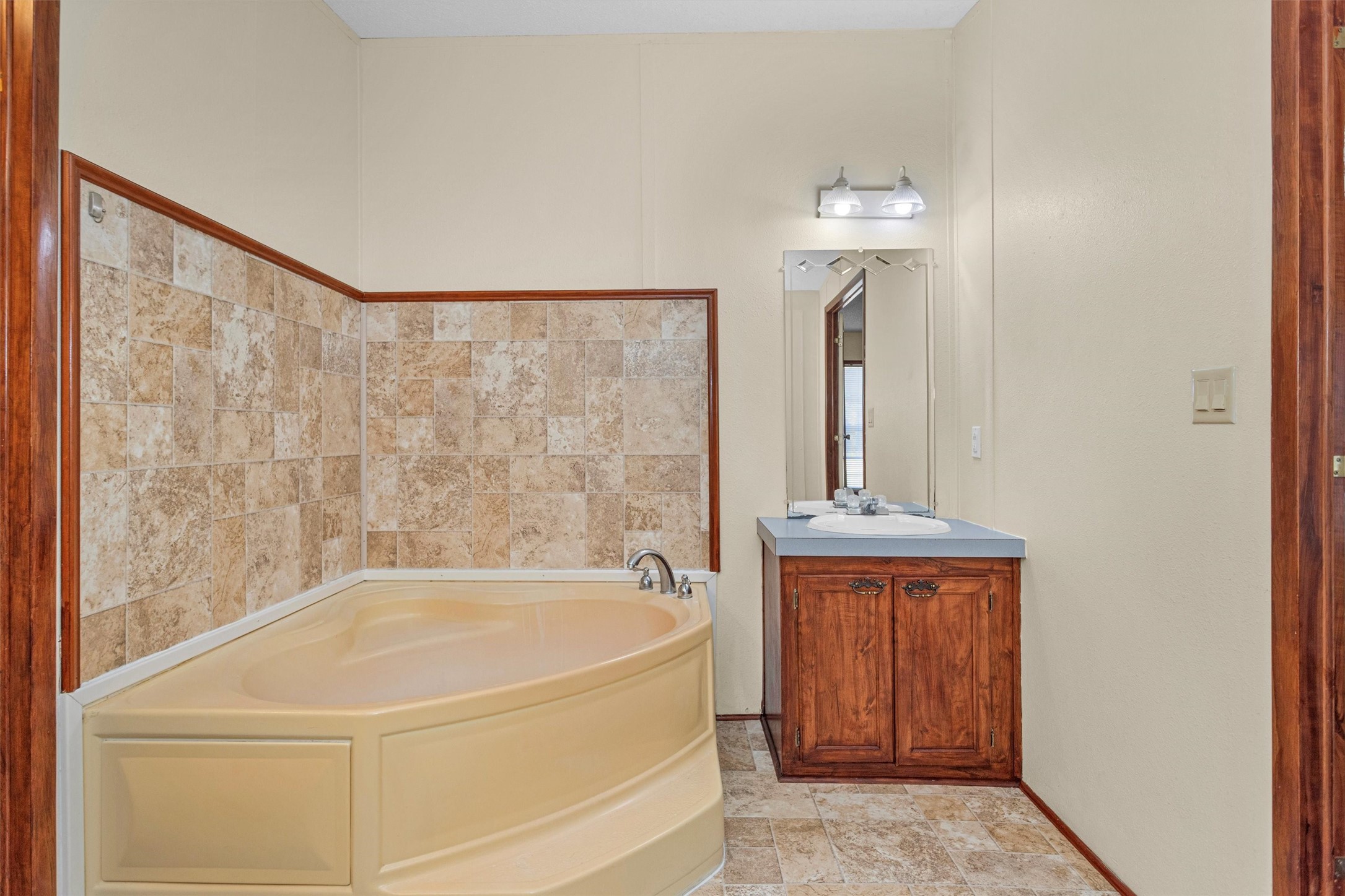 11261 Rose Road Conroe, TX 77303 - Photo 20 of 30 a bathroom with a bathtub and shower