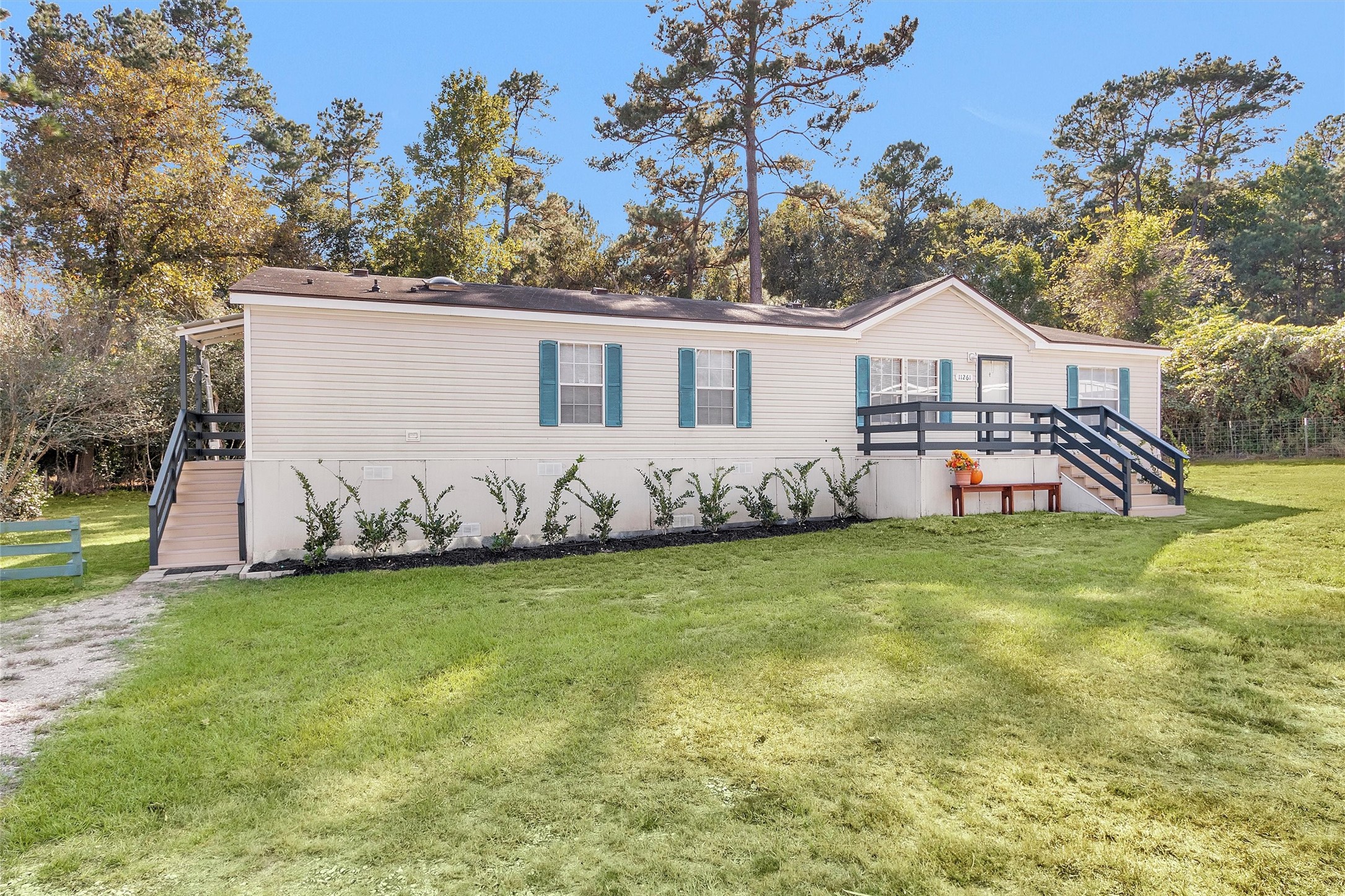 11261 Rose Road Conroe, TX 77303 - Photo 2 of 30 a view of a house with a backyard