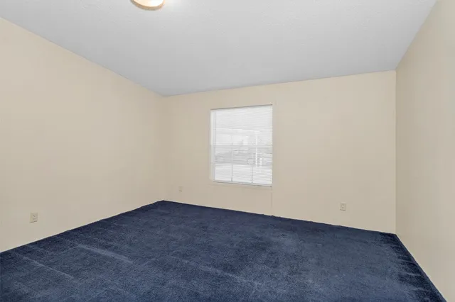 an empty room with closet area