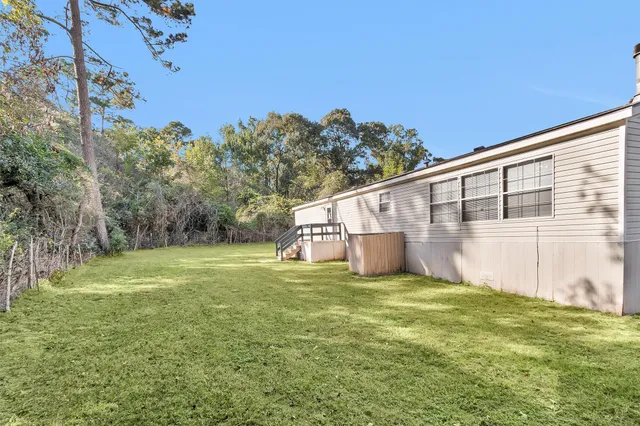a house with trees in the background