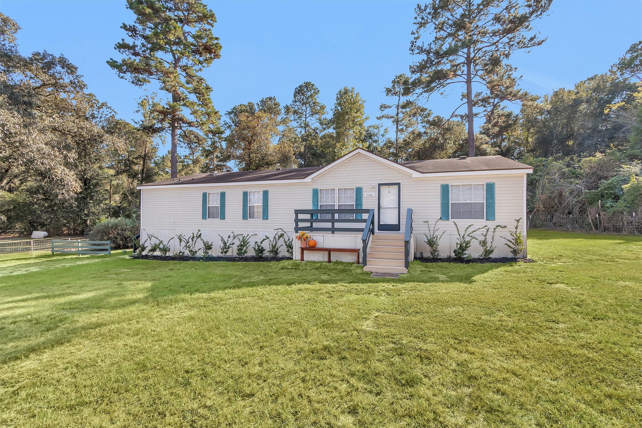11261 Rose Road Conroe, TX 77303 - Photo 3 of 30 a house view with a outdoor space