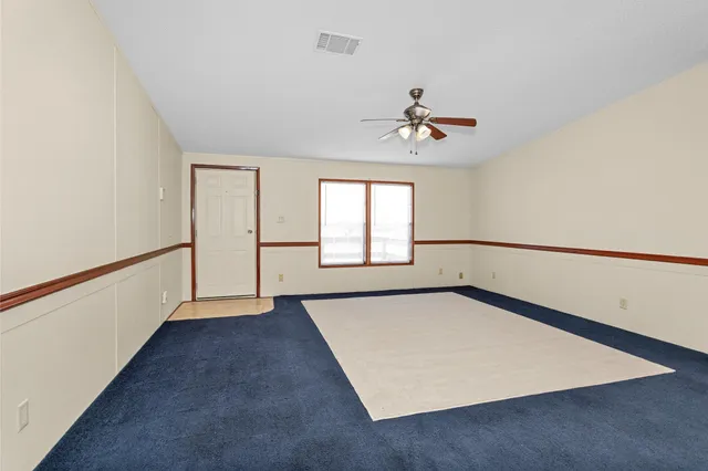 a view of a kitchen with wooden floor and a kitchen