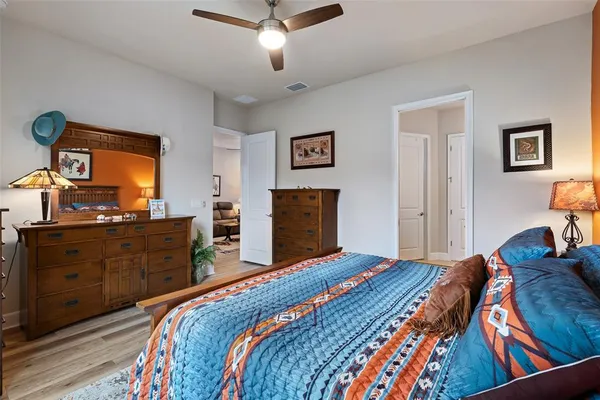 a bedroom with a bed and a dresser