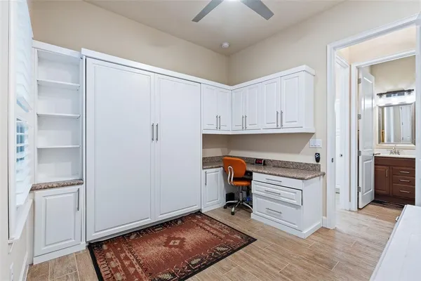 a kitchen with a refrigerator and a stove top oven