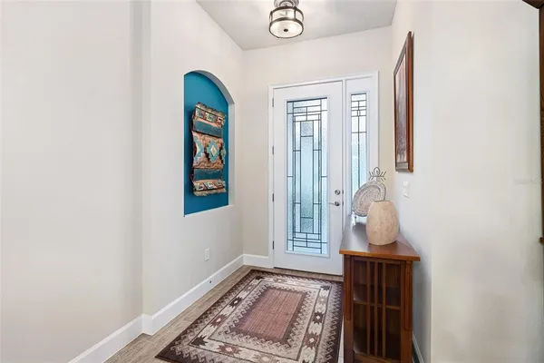 a view of an entryway with wooden floor