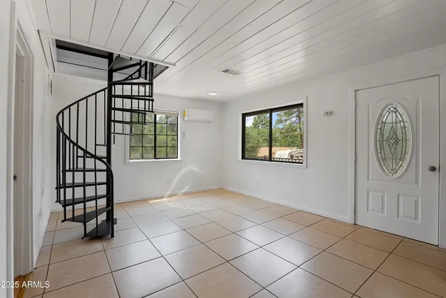 a view of entryway with wooden floor