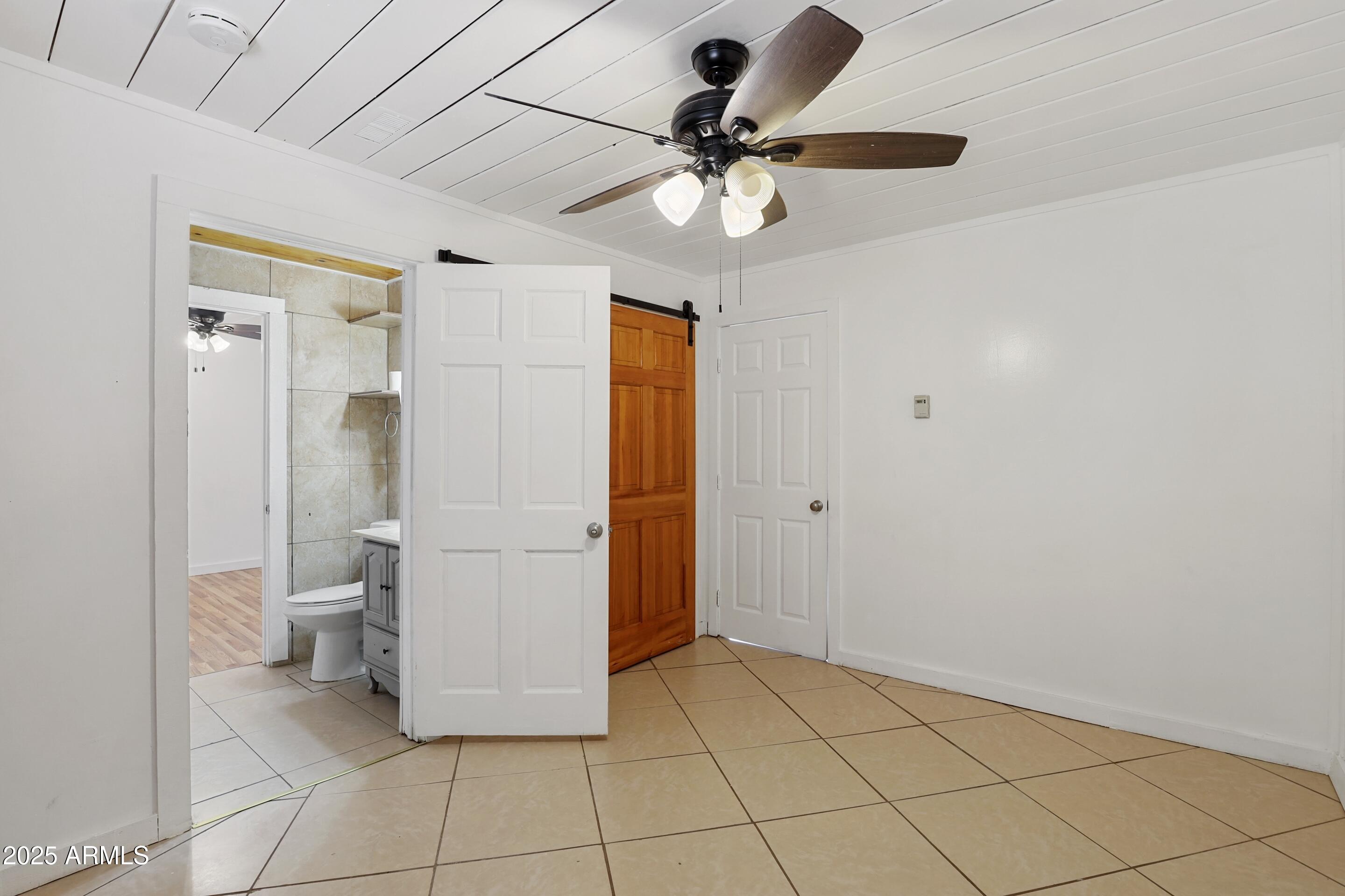 809 North Colcord Road Payson, AZ 85541 - Photo 16 of 34 a bathroom with a glass door shower a toilet and a sink