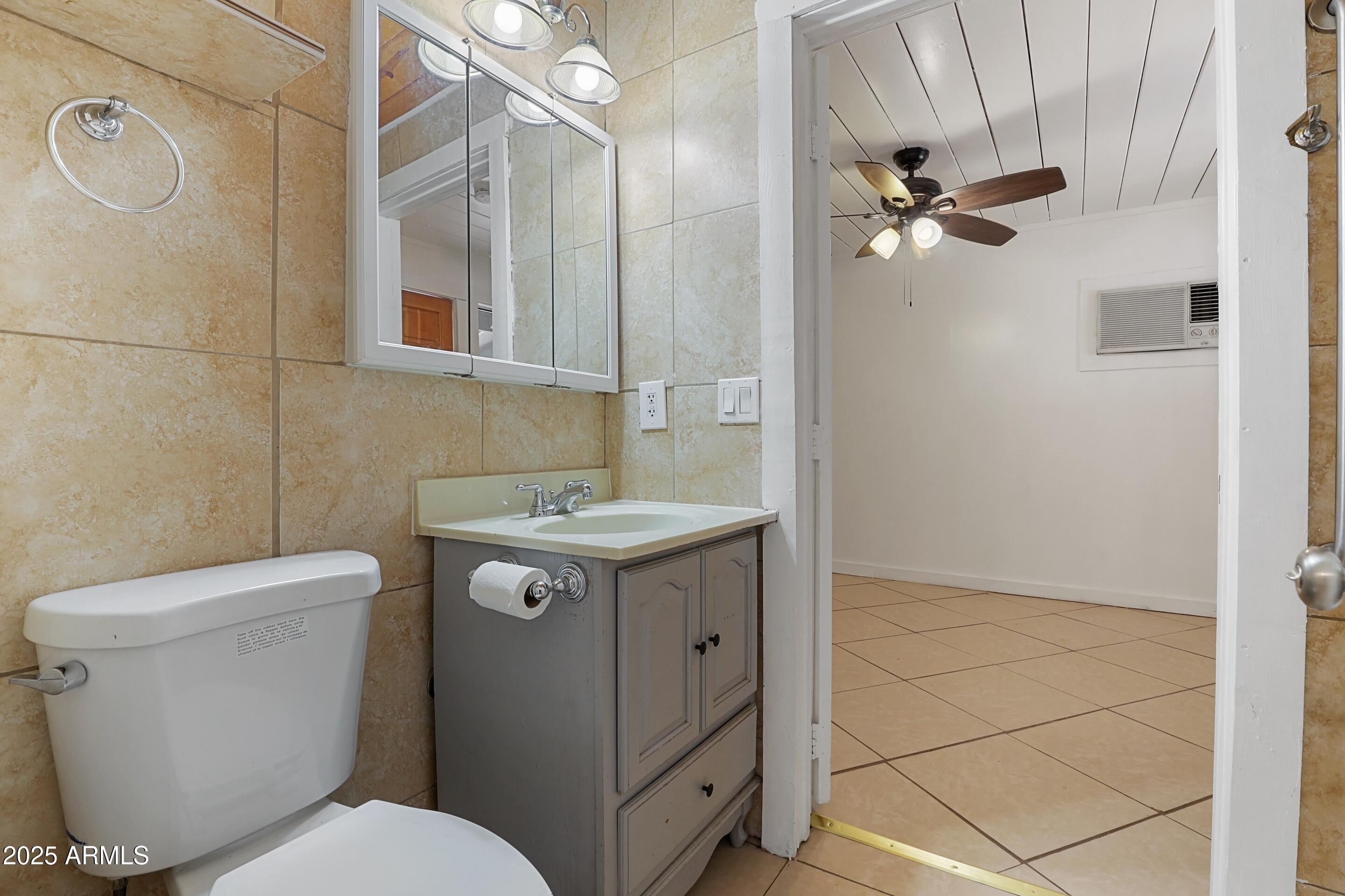809 North Colcord Road Payson, AZ 85541 - Photo 19 of 34 a bathroom with a toilet sink and mirror