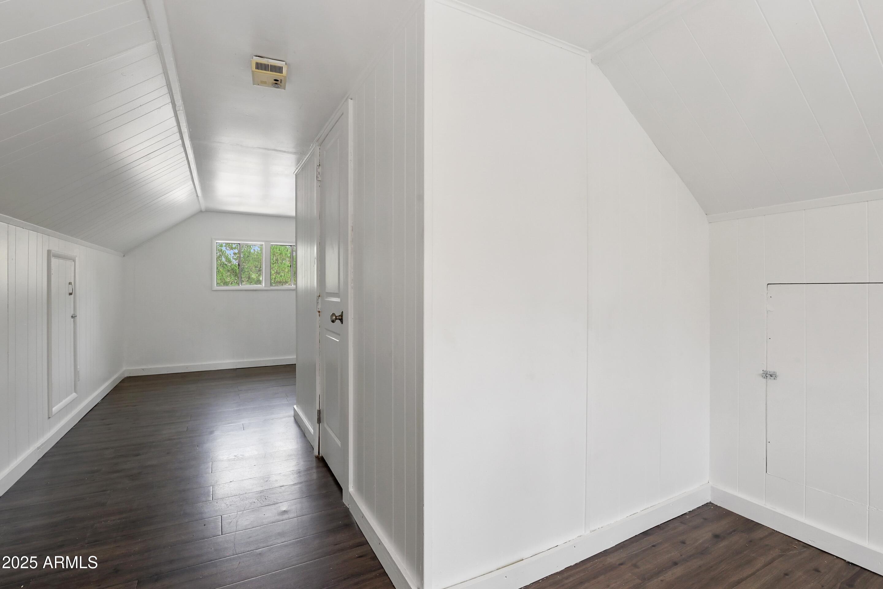 809 North Colcord Road Payson, AZ 85541 - Photo 22 of 34 a view of an empty room with wooden floor and a window
